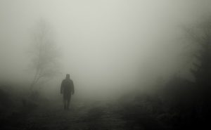 Man Walking in Fog